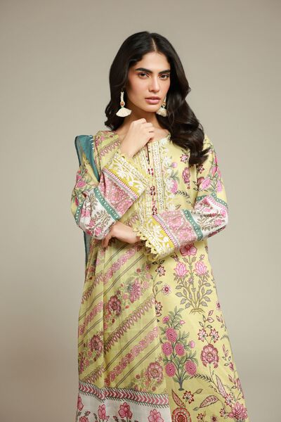 Woman wearing a yellow floral printed Wajd kurta